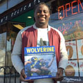 Denard Robinson with University of Michigan football gift picture book WOLVERINE: A Photographic History of Michigan Football, Vol. 1