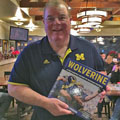 Jim Brandstatter with University of Michigan football gift picture book WOLVERINE: A Photographic History of Michigan Football, Vol. 1